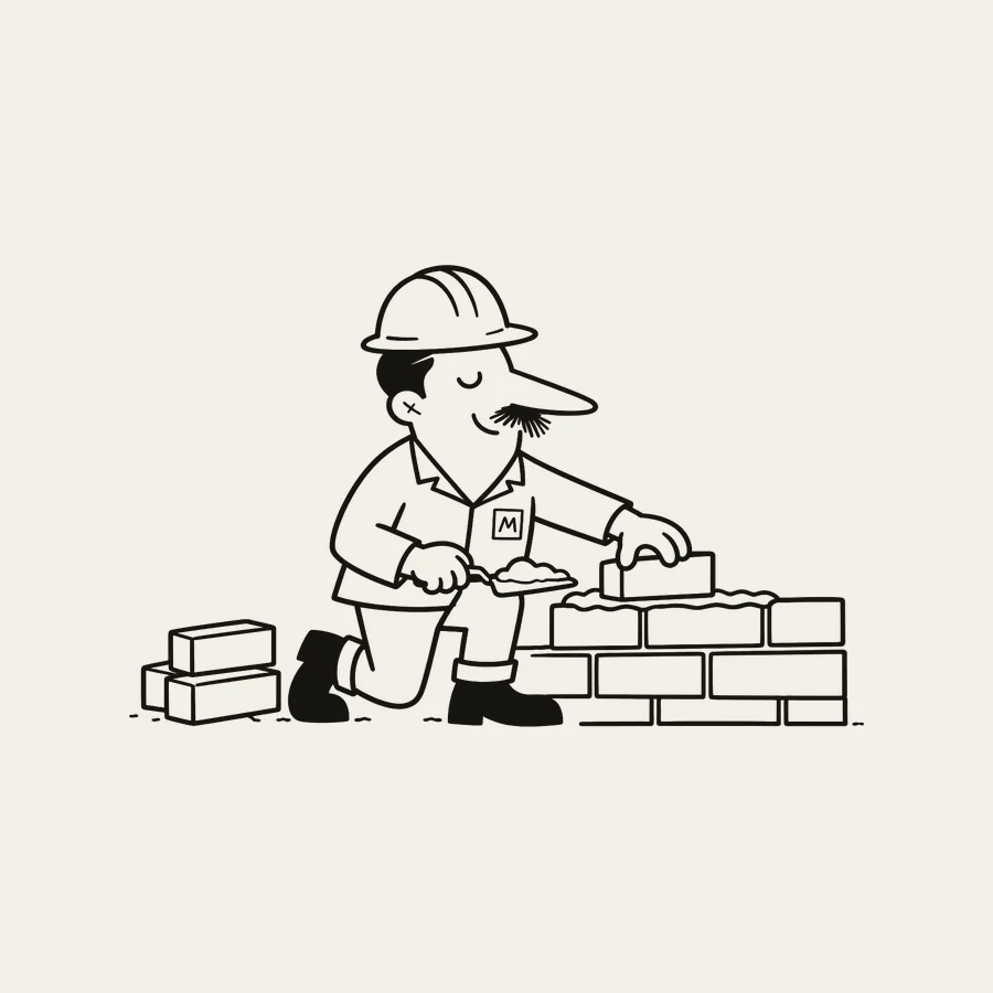 Monty laying brick